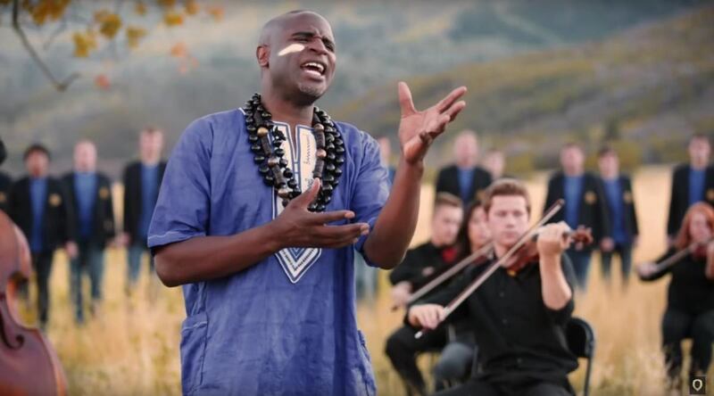 Alex Boye, the BYU Men's Chorus and the BYU Philharmonic Orchestra performed "Baba Yetu," which is the Lord's Prayer in Swahili.