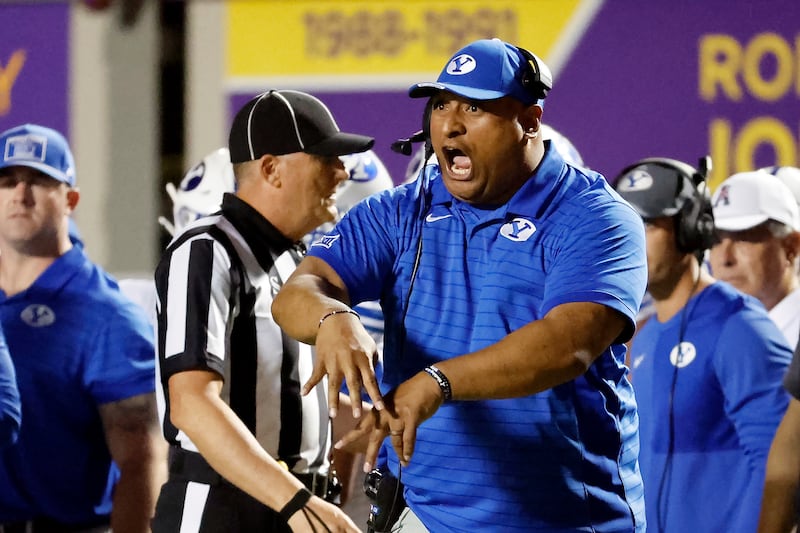BYU head coach Kalani Sitake protests a call from the sideline during game against East Carolina in Greenville, N.C., Saturday, Sept. 20, 2025.