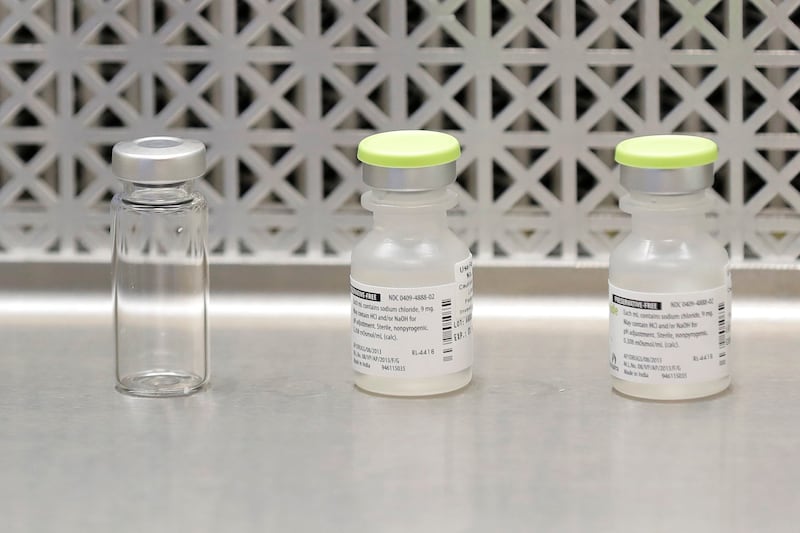 This March 16, 2020 file photo shows vials used by pharmacists to prepare syringes used on the first day of a first-stage safety study clinical trial of the potential vaccine for COVID-19, the disease caused by the new coronavirus, in Seattle.