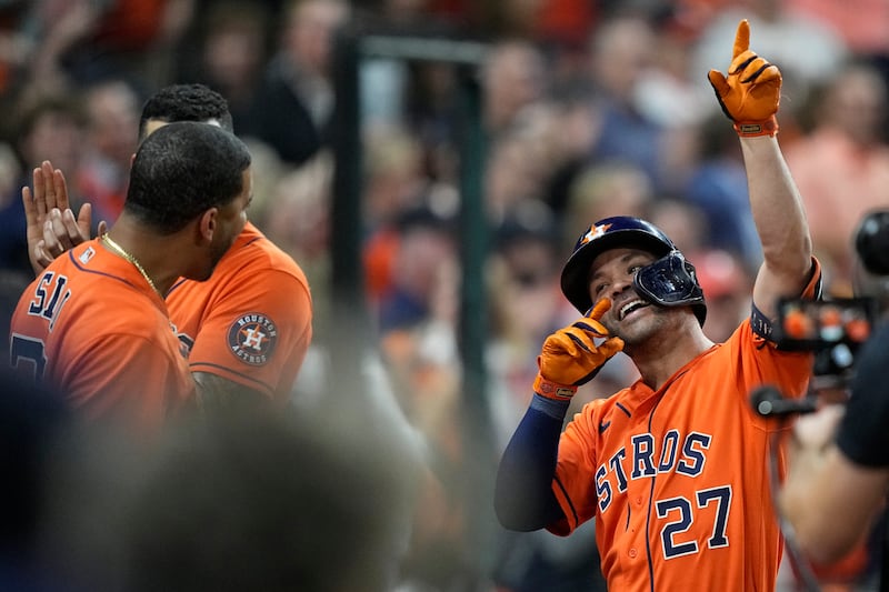 Houston Astros’ Jose Altuve celebrates after a home run during Game 2 of World Series against the Atlanta Braves in Houston.