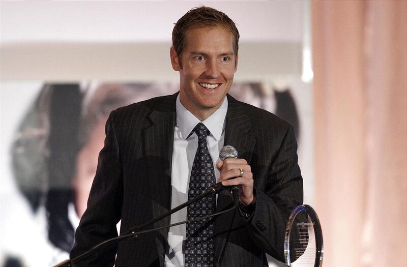 Former BYU Cougar basketball player Travis Hansen receives an award during Operation Smile's 5th annual Breakfast of Smiles in Salt Lake City Tuesday, Sept. 20, 2011. Hansen is retiring from professional basketball.
