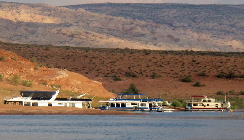 It’s not hard for houseboats to find an ideal beach to park. Houseboats remain the most popular way to stay on shore of Lake Powell, August 10, 2009 Photo by Ray Grass