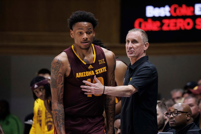 Arizona State head coach Bobby Hurley, right, speaks with Arizona State's BJ Freeman (10) during a charity exhibition game against Duke in Durham, N.C., Sunday, Oct. 27, 2024.