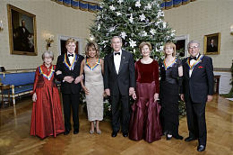 President Bush, center, and first lady Laura Bush join Kennedy Center honorees actress Julie Harris, left, actor/director Robert Redford, singer Tina Turner, ballet dancer Suzanne Farrell and singer Tony Bennett at the White House Sunday.