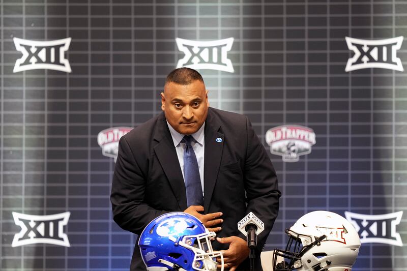 BYU coach Kalani Sitake sits before speaking at the Big 12 college football media days in Arlington, Texas, Wednesday, July 12, 2023.