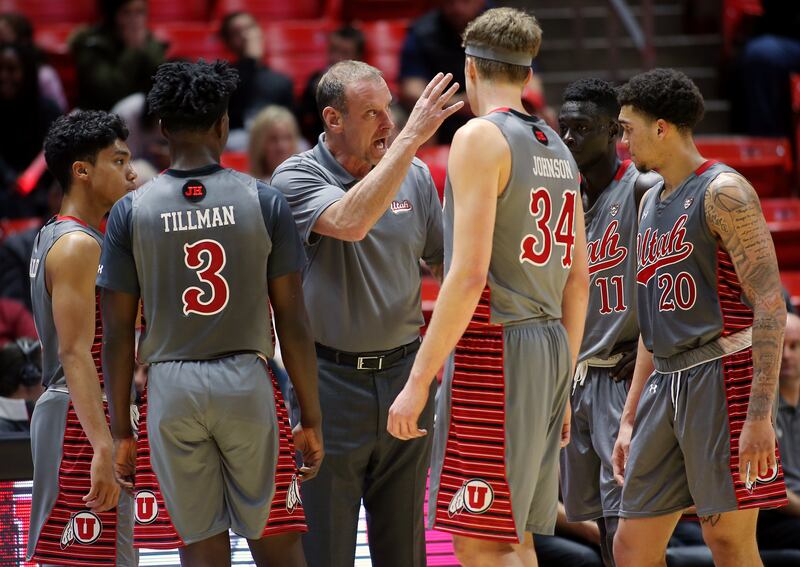 Utah Utes head coach Larry Krystkowiak talks with his players during a timeout as Utah and Colorado play in the Huntsman Center in Salt Lake City on Sunday, Jan. 20, 2019. Utah won 78-69.