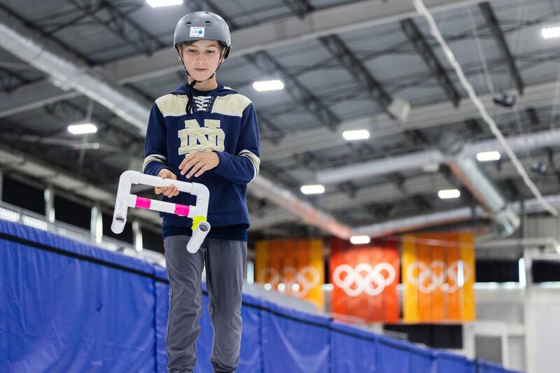 Ethan Marcheschi, 10, learns to curl at the Utah Olympic Oval in Kearns on June 16, 2023.