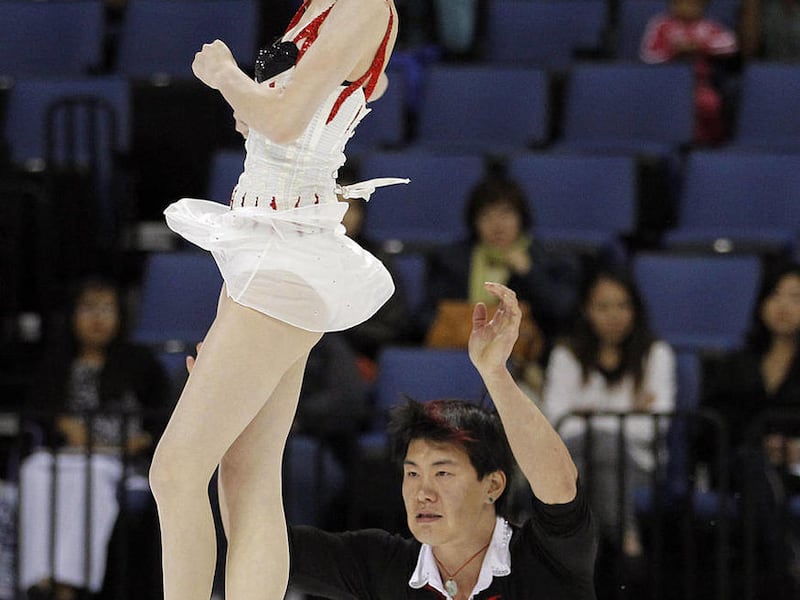 Zhang Dan, left, and Zhang Hao, of China, compete during the pairs short program at the Skate America figure skating competition in Ontario, Calif., Saturday, Oct. 22, 2011. The pair placed first.