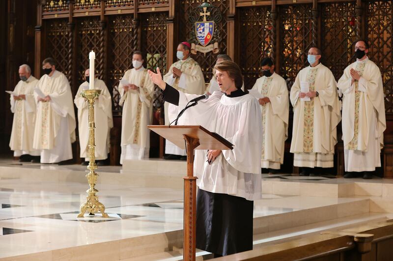 Latter-day Saint John Richardson sings during a Catholic Mass in the Cathedral of the Madeleine.