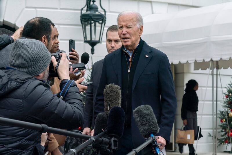 President Joe Biden speaks to members of the media as he leaves the White House.