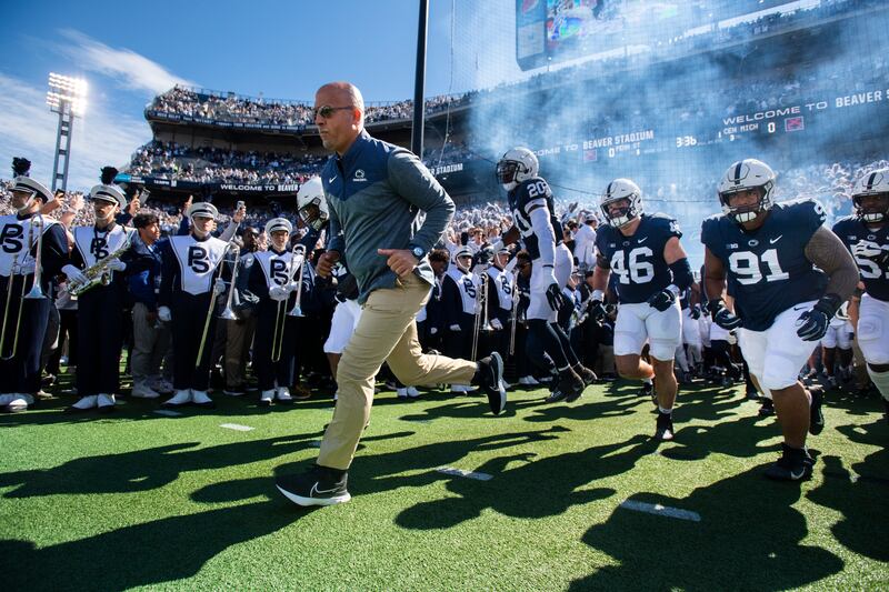 Penn State head coach James Franklin leads his team onto the field for a game against Central Michigan.