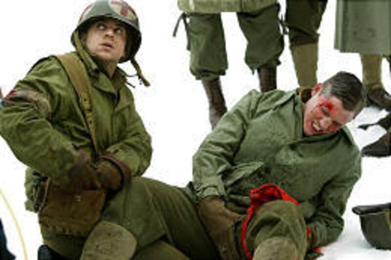 Alex Niver, left, and Ben Gourley perform during the filming in 2003 for "Saints and Soldiers," which originally was given an R rating.