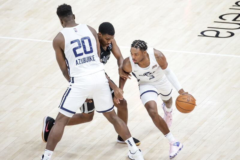 Utah Jazz center Udoka Azubuike sets a pick so guard Trent Forrest can get past San Antonio Spurs guard Justin Turner