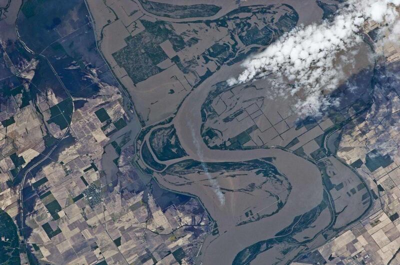 This Thursday, May 12, 2011 image provided by NASA on Saturday, May 14, 2011, taken by an Expedition 27 crew member aboard the International Space Station, shows the outlines of heavily flooded agricultural fields on the Missouri side of the Mississippi r