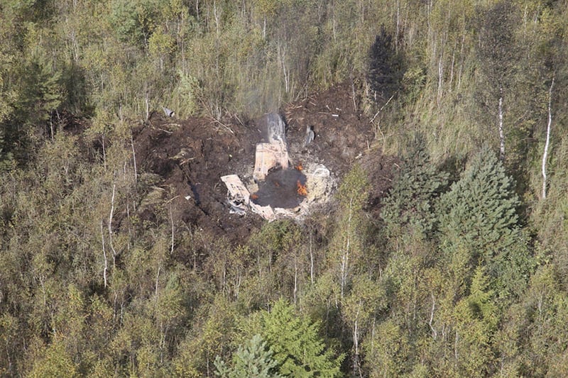 In this photo distributed by Lithuanian Defense Ministry, Tuesday, Aug. 30, 2011, th wreckage of Czech-made Lithuanian L-39 jet is seen near the Zokniai air base in northern Lithuania. Lithuania's Defense Ministry said Tuesday, that the Lithuanian militar