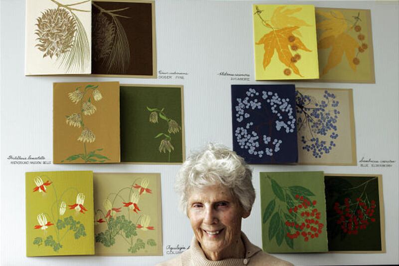 Gene Bauer is surrounded by her botanical serigraphs in her Running Springs, California, home.