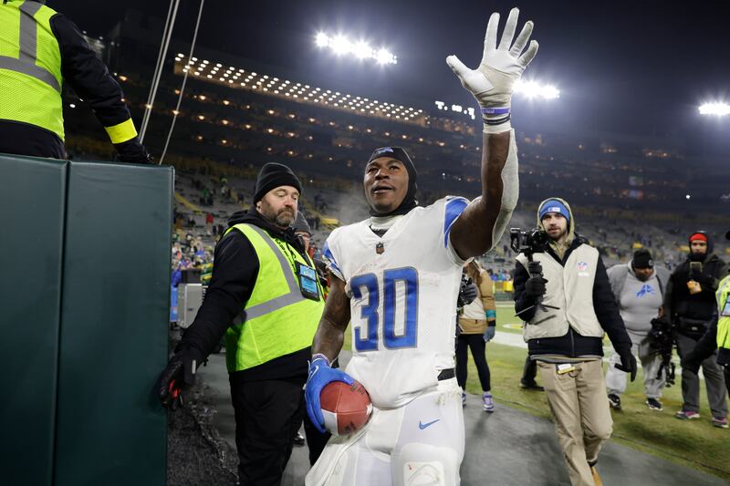 Detroit Lions running back Jamaal Williams celebrates following an NFL football game against the Green Bay Packers.