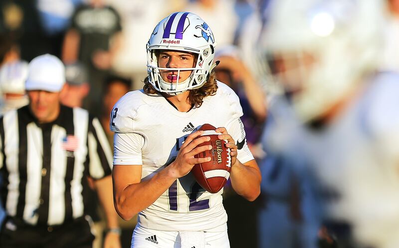 Lehi quarterback Cammon Cooper looks to throw against Alta on Friday, Aug. 18, 2017.