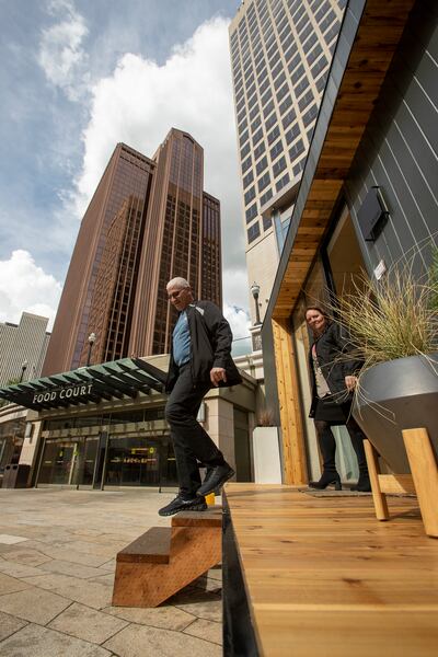Nick Emanoilidis, from Toronto, Canada, and Tanya Baker, of Eagan, Minn., step out of a Modal Living home at City Creek Center in Salt Lake City on Monday, May 20, 2019.