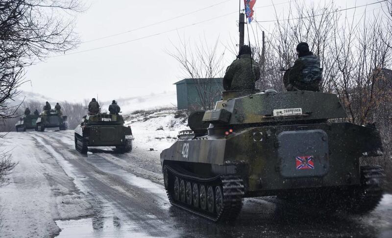 A pro-Russian armored vehicle moves toward Slovyanoserbsk, eastern Ukraine, Wednesday, Jan. 21, 2015.