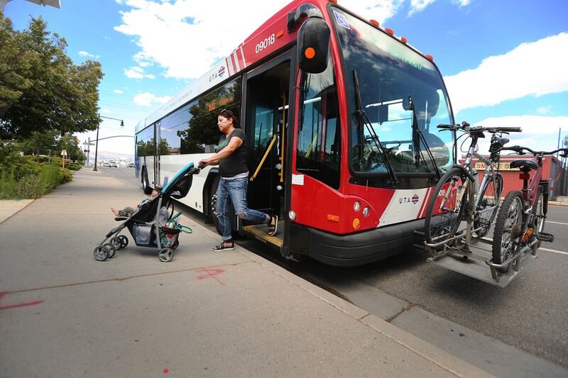 A passenger gets off a Utah Transit Authority bus on State Street. in Murray on Tuesday, June 19, 2018. Draper and Sandy City Councils passed resolutions Tuesday to support the 0.25 percent tax hike for transportation, surpassing the required support from
