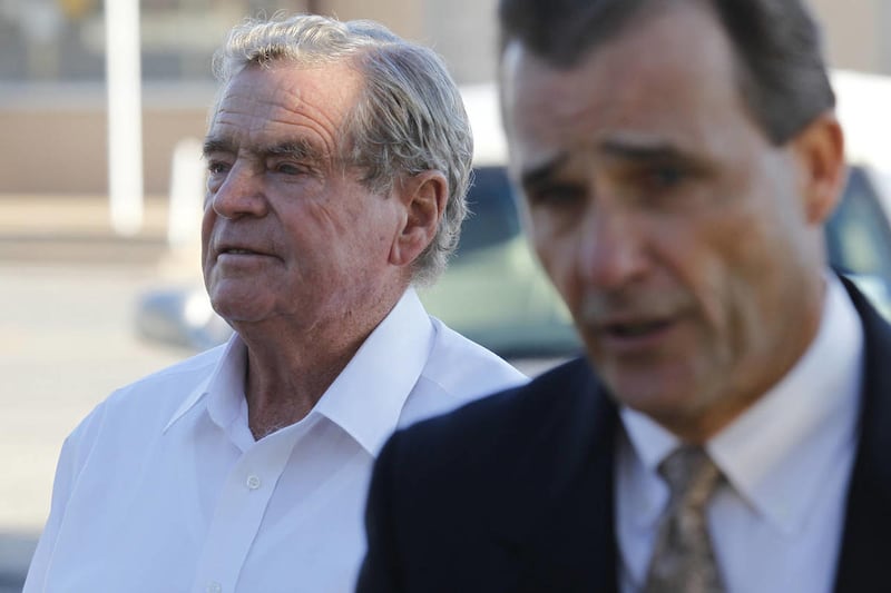 Fredrick Merril Jessop, a former leader of the Fundamentalist Church of Jesus Christ of Latter Day Saints, walks to the front entrance of the Coke County Courthouse in Robert Lee, Texas on Monday, Oct. 31, 2011 with attorney Rae Leifeste.