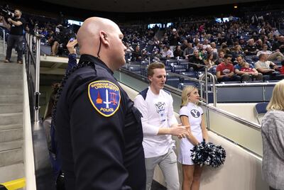 BYU police secure the court at a university basketball game in Provo on Thursday, Feb. 21, 2019.