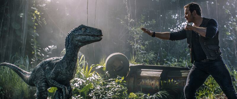 This image released by Universal Pictures shows Chris Pratt in a scene from "Jurassic World: Fallen Kingdom."