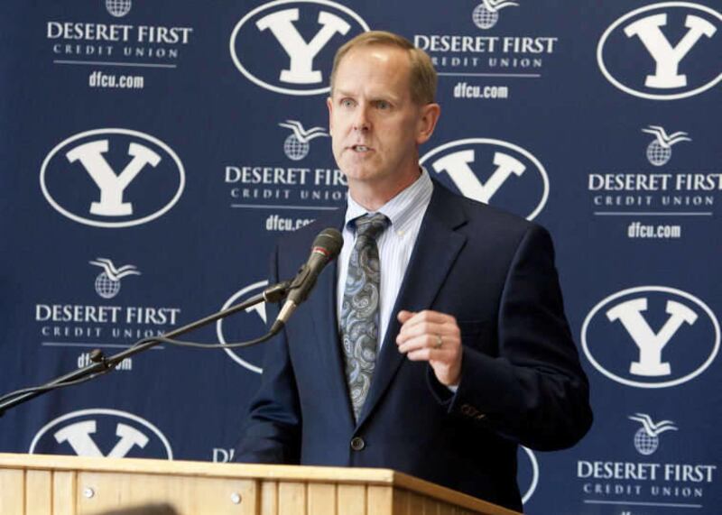Tom Holmoe, athletic director at Brigham Young University, speaks during a press conference announcing a new contract for coach Dave Rose Wednesday, April 6, 2011.