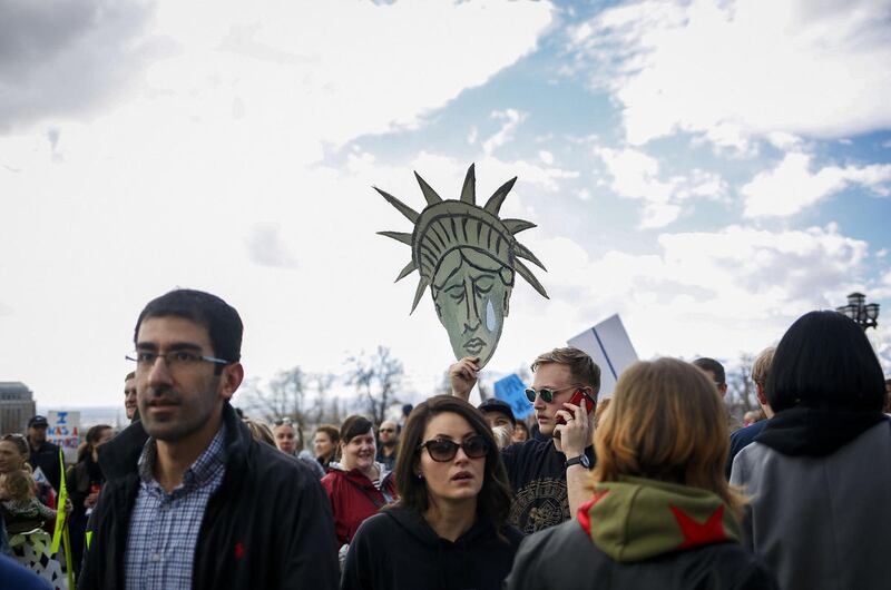 FILE"” The Utah March for Refugees and the Mormons for Muslims march meet outside the Utah State Capitol in Salt Lake City on Saturday, Feb. 4, 2017 to protest President Trumps ban on refugees and immigrants from Muslim countries.