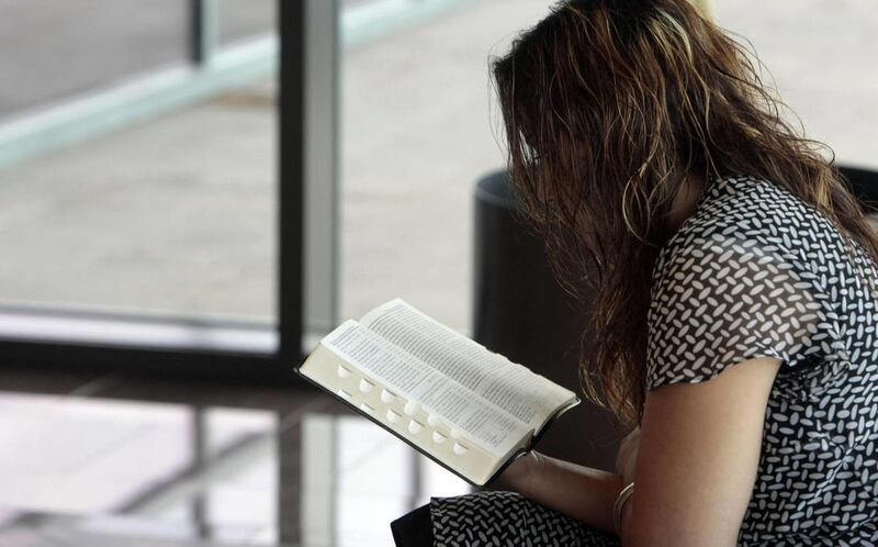 Cecilia Salinas of Mesa, AZ reads her scriptures during the Sunday morning session of the 178th Semiannual General Conference of the Church of Jesus Christ of Latter-day Saints at the Conference Center in Salt Lake City Sunday, October 5, 2008.
