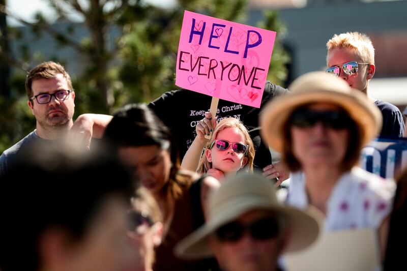 Claire Stradling, 7, of Draper, holds a sign while attending a "Close the Camps" vigil organized by Jewish groups outside the U.S. Immigration and Customs Enforcement field office in West Valley City on Saturday, Aug. 10, 2019. Stradling attended the rall