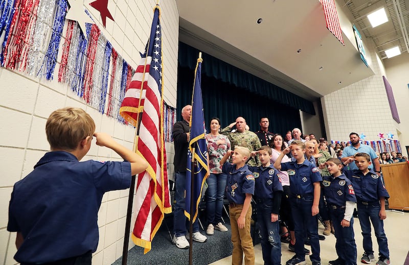 Cub Scouts lead a flag ceremony during an assembly honoring veterans at Midas Creek Elementary in Riverton on Nov. 12, 2018.