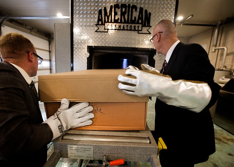 Cole Houghton, owner of Tate Mortuary, and Boomer Benson cremate a body at the mortuary in Tooele in June 2018. Houghton has ordered an alkaline hydrolysis machine, making him the only mortician in Utah who will have the ability to offer water cremations