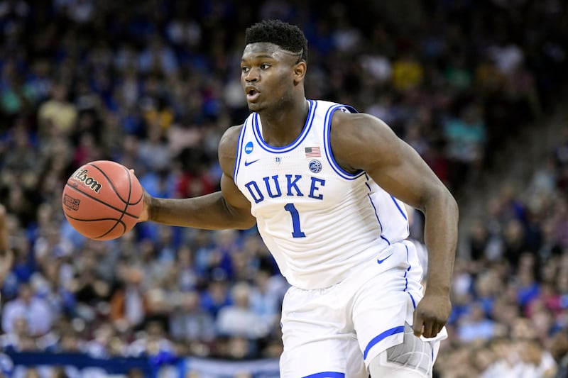 FILE - In this March 24, 2019, file photo, Duke forward Zion Williamson (1) dribbles the ball against Central Florida during the first half of a second-round game in the NCAA men's college basketball tournament in Columbia, S.C. Williamson was named the J