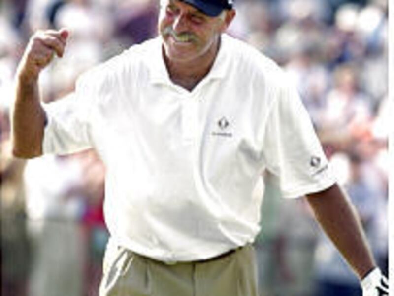 Mark James of Britain celebrates his victory on No. 18 after making a putt for par during the final round of the Senior Players Championship.