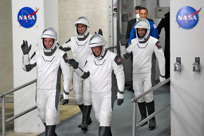 Warren Hoburg, Andrey Fedyaev, Cmdr. Stephen Bowen and Sultan al-Neyadi leave the Operations and Checkout building at the Kennedy Space Center.