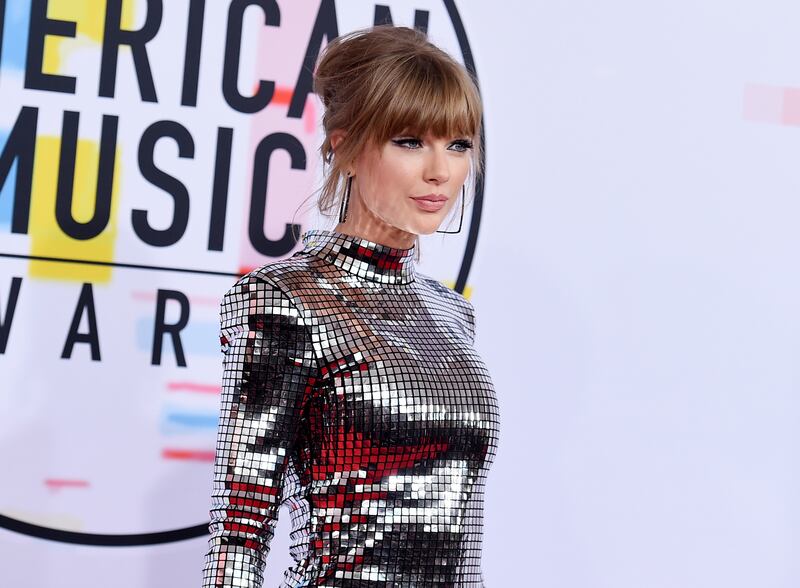In this Oct. 9, 2018, file photo, Taylor Swift arrives at the American Music Awards at the Microsoft Theater in Los Angeles.