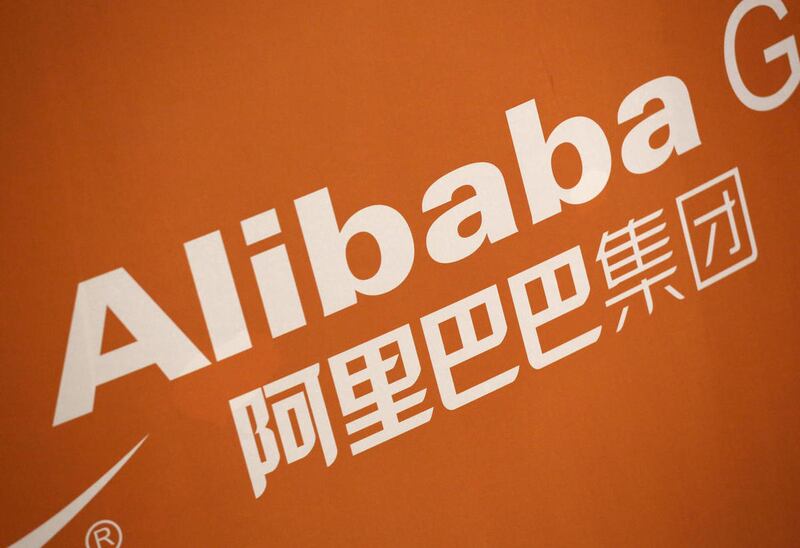 In this Sept. 19, 2014 file photo, the Alibaba logo is displayed during the company's IPO at the New York Stock Exchange in New York. Chinese regulators accused e-commerce giant Alibaba on Wednesday, Jan. 28, 2015 of permitting sales of fake goods and hur