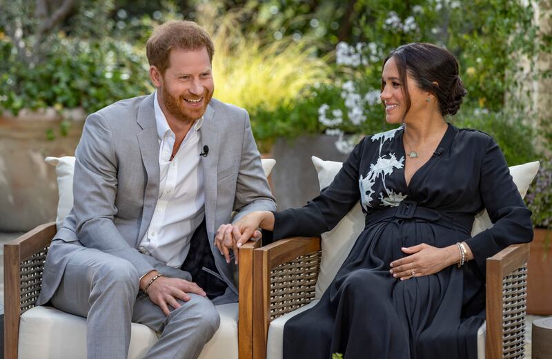 This image provided by Harpo Productions shows Prince Harry, left, and Meghan, Duchess of Sussex, speaking about expecting their second child during an interview with Oprah Winfrey. “Oprah with Meghan and Harry: A CBS Primetime Special” airs March 7 as a two-hour exclusive primetime special on the CBS Television Network.