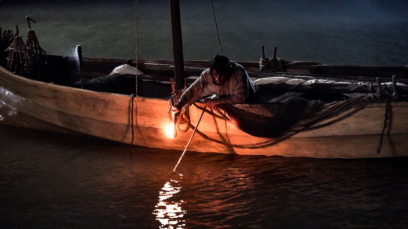 Simon Peter fishes at night in a scene from Season 1 of “The Chosen.”