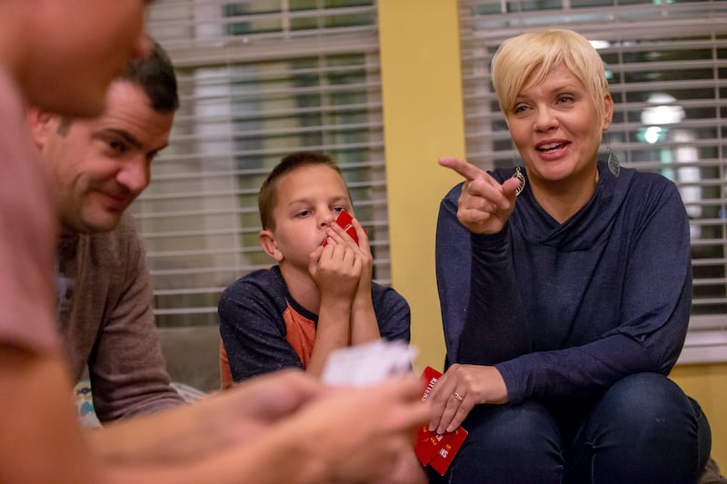 Betsy Batman talks during a family card game a she and her husband Andrew enjoy time at home with three of their kids, Ellie, Jon, and Gavin, in South Jordan on Wednesday, Nov. 7, 2018.