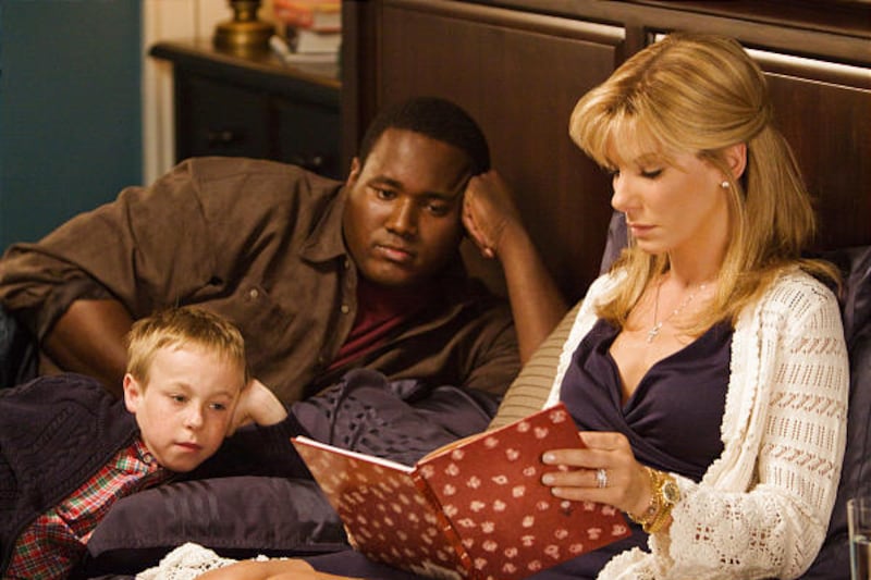 Jae Head, left, Quinton Aaron and Sandra Bullock in a scene from "The Blind Side."