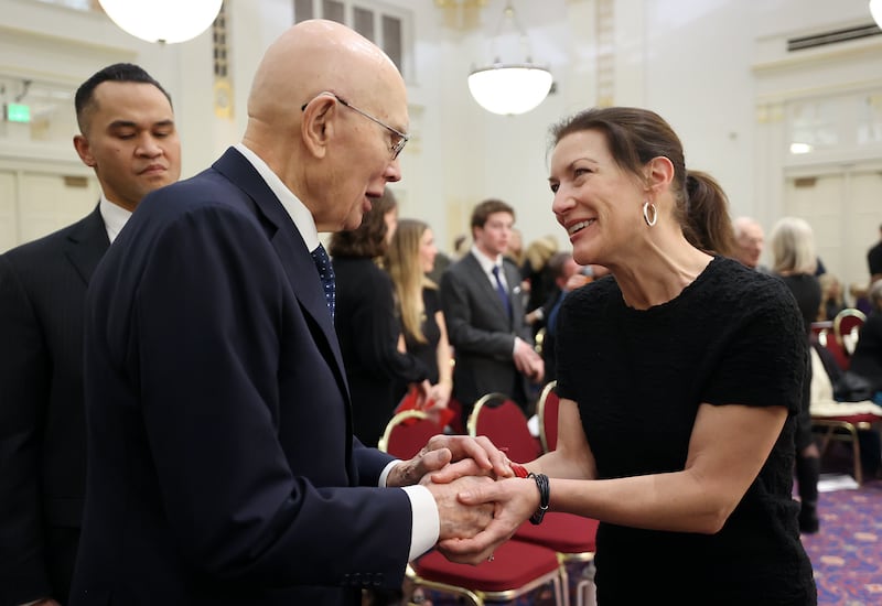 President Dallin H. Oaks, first counselor in the First Presidency of The Church of Jesus Christ of Latter-day Saints, talks with Marci Dunne after a memorial service for Dunne’s father David Gardner.