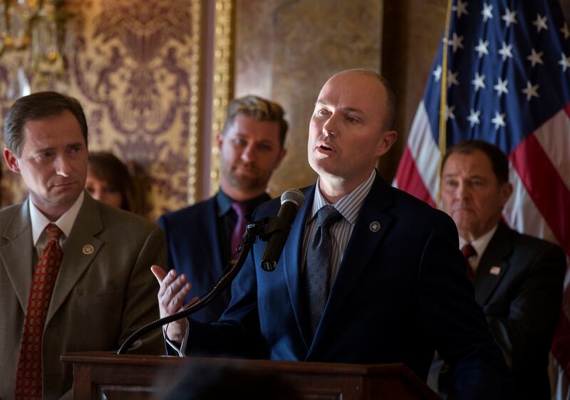 Rep. Steve Eliason, R-Sandy, left, Troy Williams, executive director of Equlity Utah, and Gov. Gary Herbert, right, listen as Lt. Gov. Spencer Cox, center, speaks at a press conference announcing the formation of a Youth Suicide Prevention Task Force at t