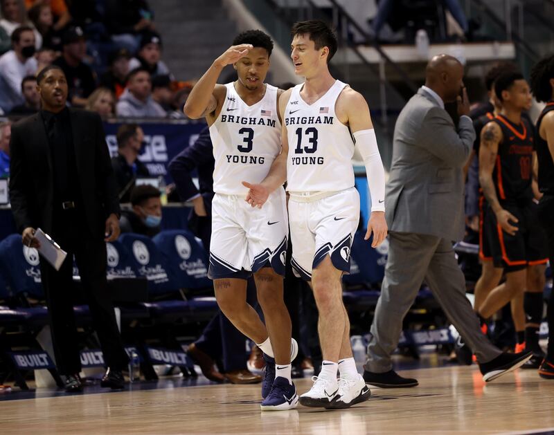 BYU guard Te’Jon Lucas (3) high-fives teammate Alex Barcello during game against Pacific in Provo on Thursday, Jan. 6, 2022.