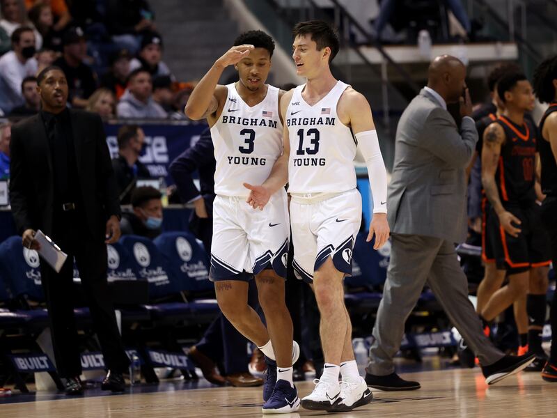 BYU guard Te’Jon Lucas (3) high-fives teammate Alex Barcello during game against Pacific in Provo on Thursday, Jan. 6, 2022.