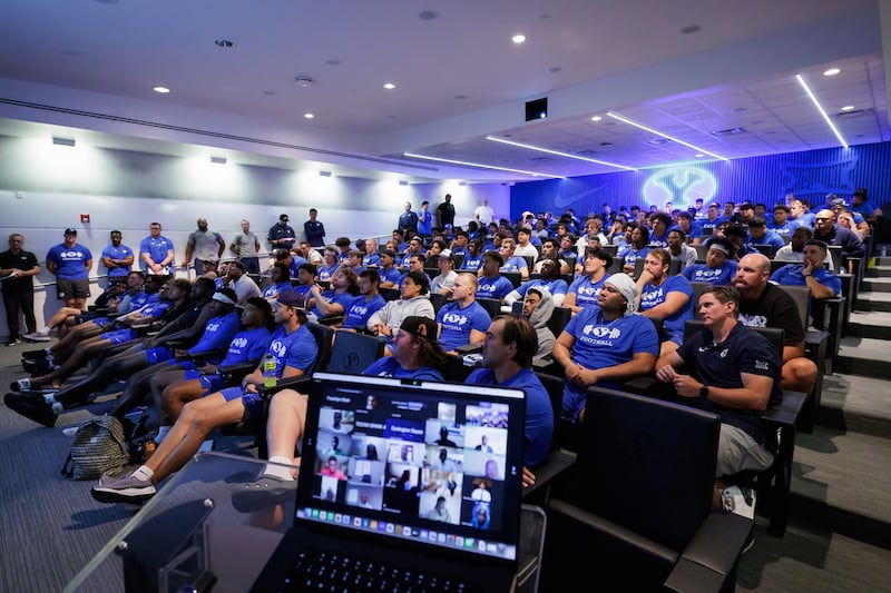 The BYU football team meets over Zoom with 300 African BYU-Pathway students in August 2024.