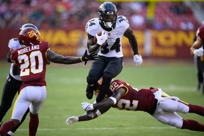 Baltimore Ravens running back Ty’Son Williams (34) runs with the ball against the Washington Football Team.