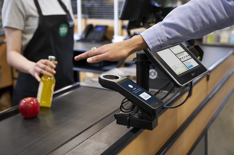 A palm scanner will soon be able to be utilized to provide payment at Whole Foods Market, which is owned by Amazon.